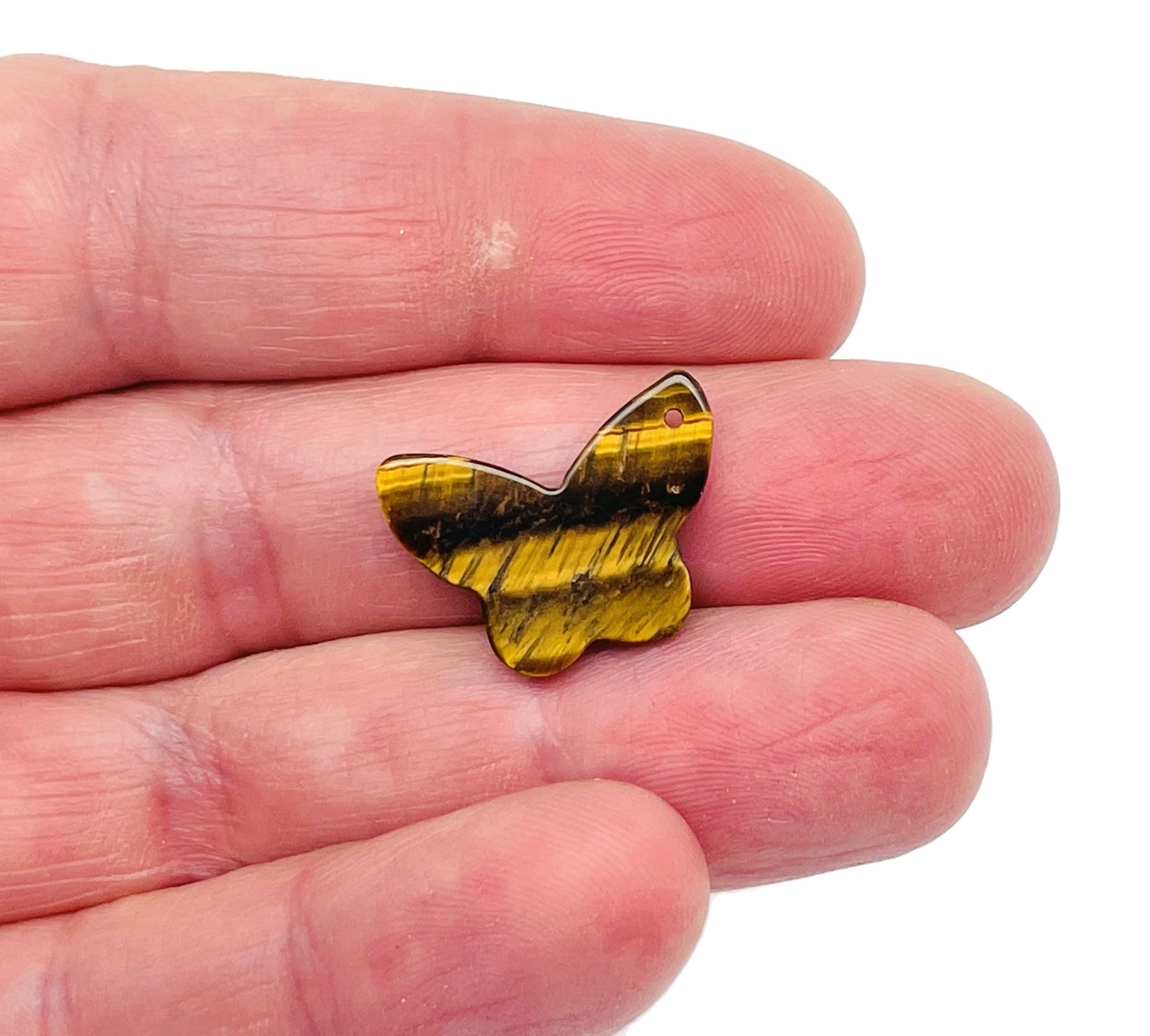 Tiger Eye mini butterfly gemstone pendant with hole for crystal jewelry, featuring warm golden-brown tones and detailed butterfly design.