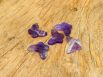 Amethyst mini butterfly gemstone pendant from GemstoneGO featuring a hole crystal jewelry design on a white background.