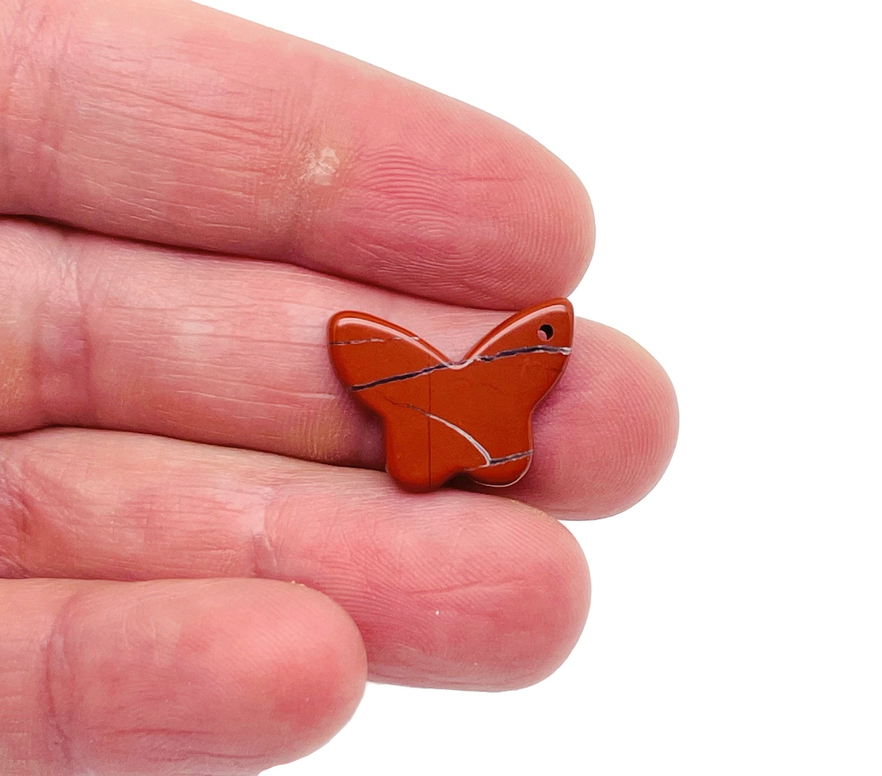 Red Jasper mini butterfly gemstone pendant with hole crystal jewelry from GemstoneGO, showcasing a vibrant red jasper butterfly charm.
