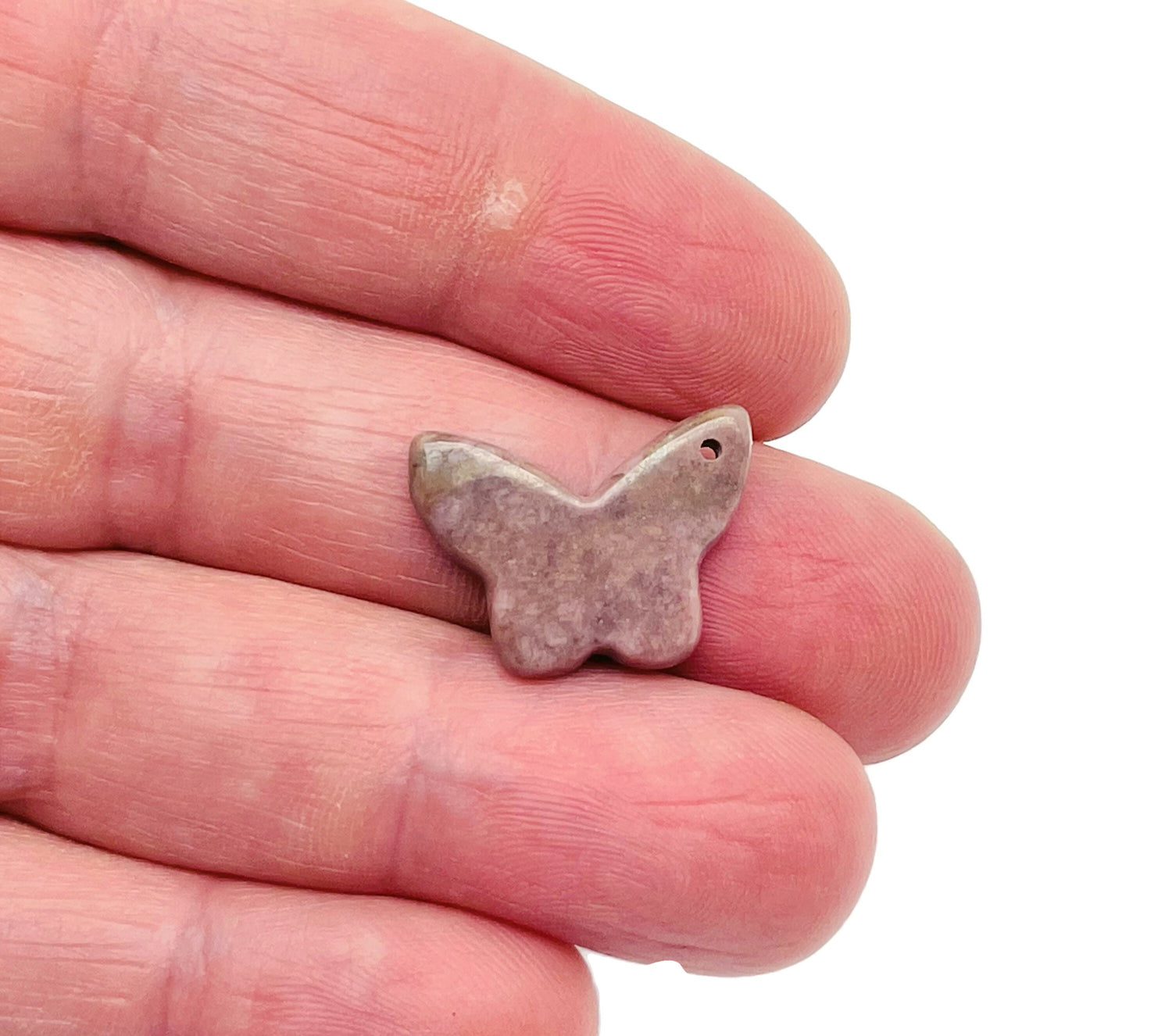 Rhodonite mini butterfly gemstone pendant with hole for necklace, showcasing vibrant pink and black patterns, by GemstoneGO.