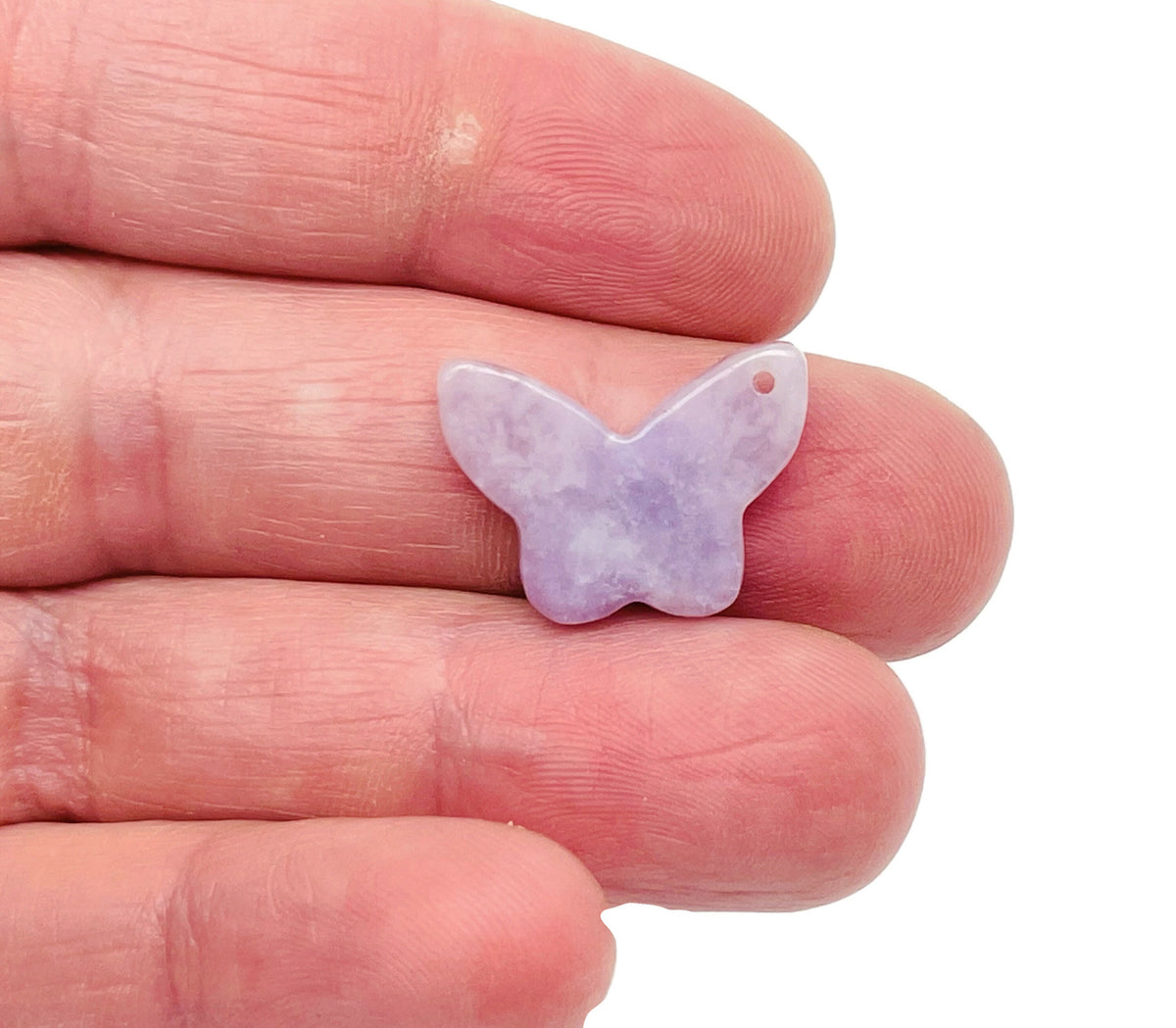 Lepidolite mini butterfly gemstone pendant with hole for jewelry, showcasing purple crystal and detailed butterfly design.