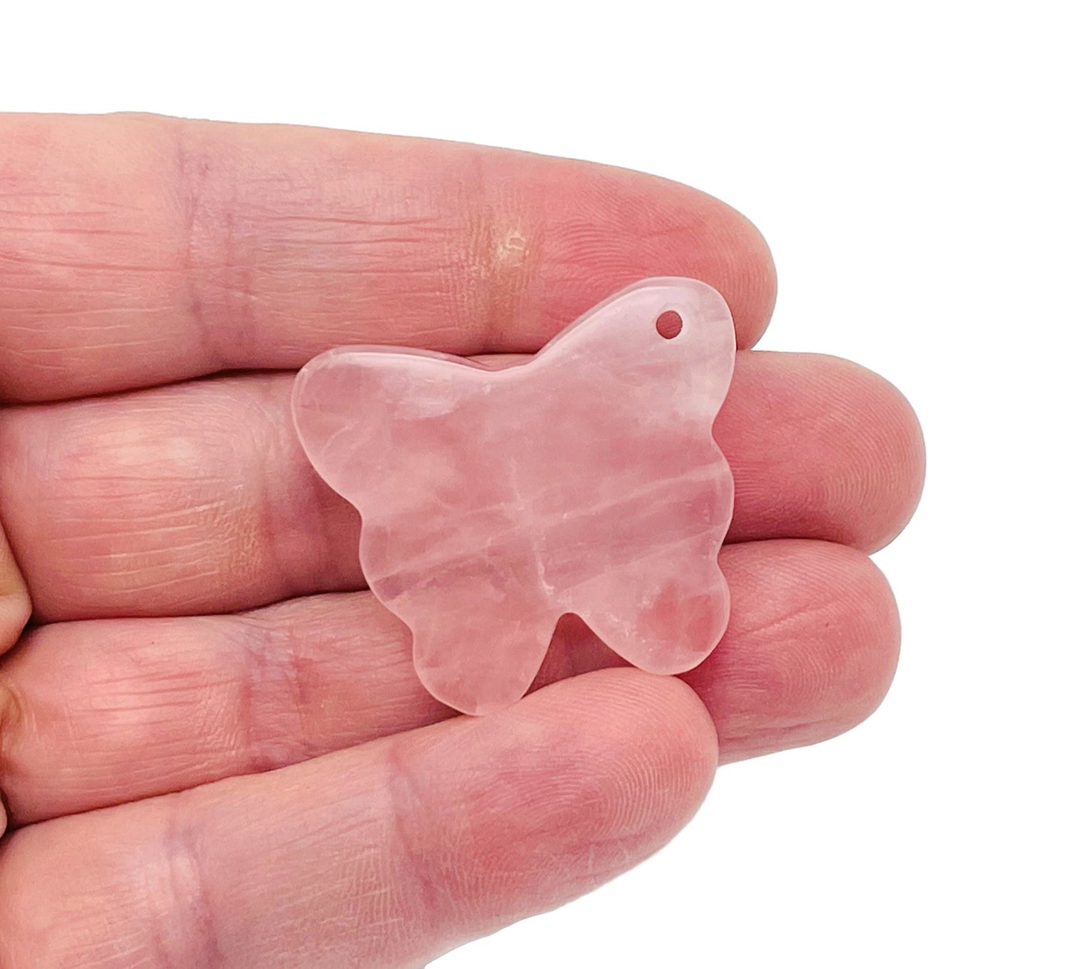 Rose quartz butterfly gemstone pendant with hole crystal jewelry, showcasing a delicate pink quartz butterfly charm.