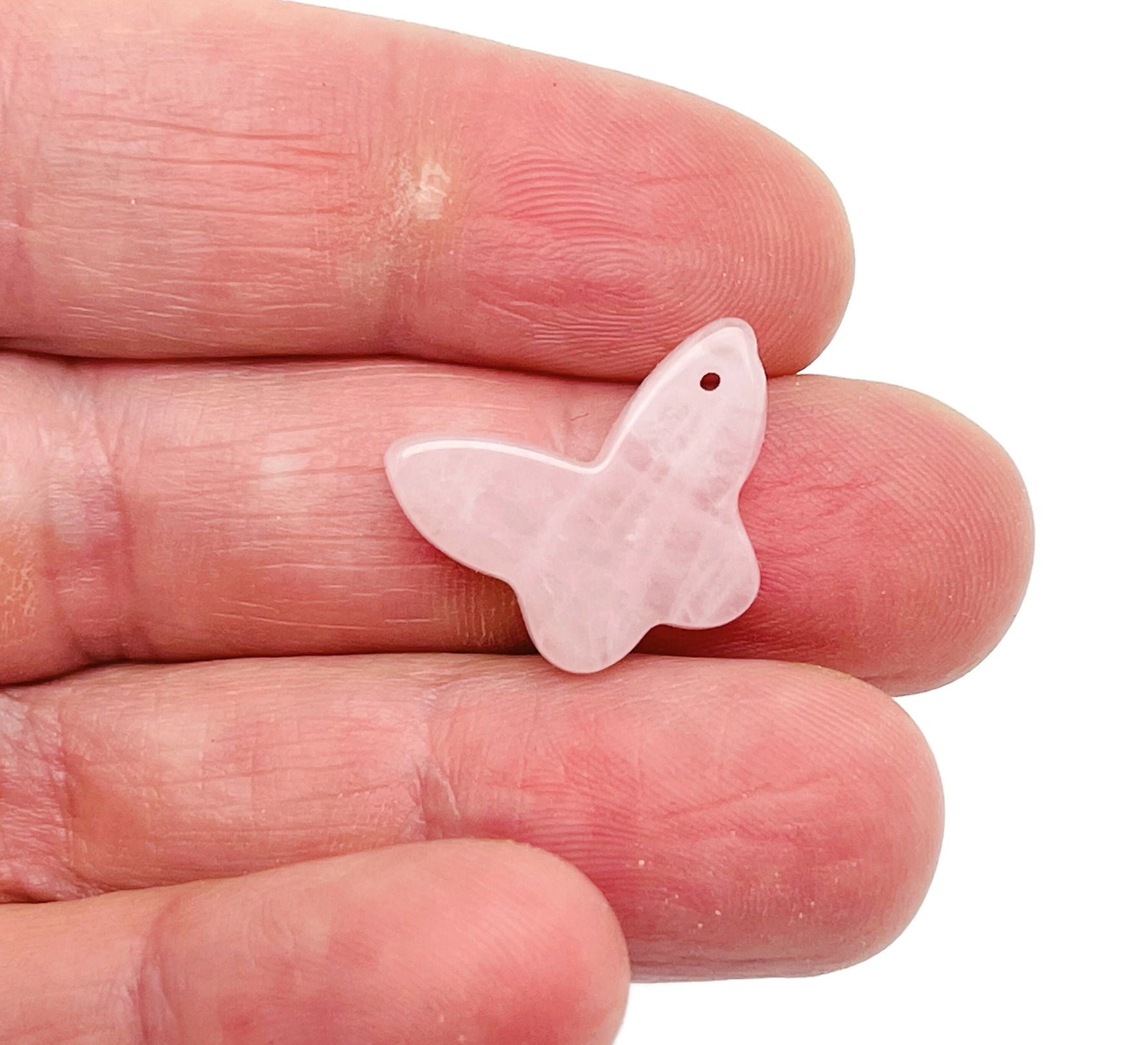 Rose quartz mini butterfly gemstone pendant with hole crystal jewelry, showcasing a delicate pink butterfly design by GemstoneGO.