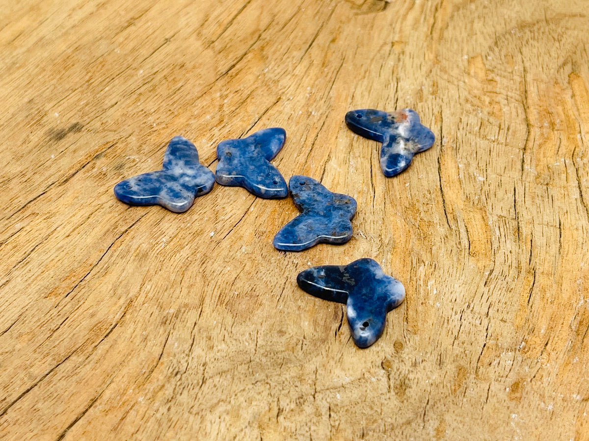 Sodalite mini butterfly gemstone pendant from GemstoneGO, featuring a hole crystal design in blue and white gemstone.