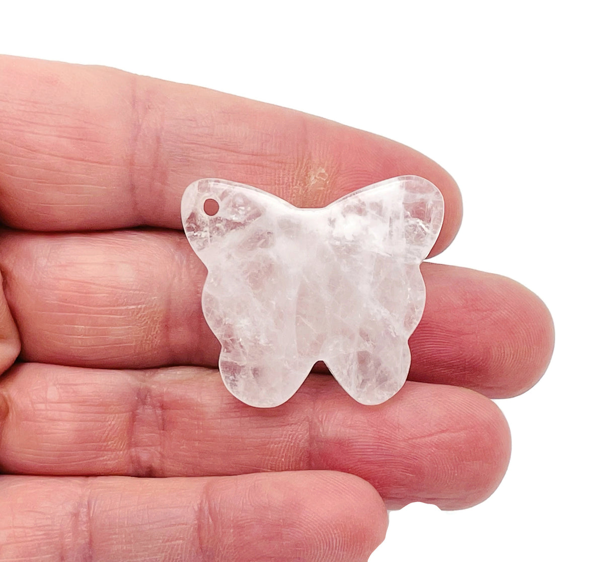 Clear quartz butterfly gemstone pendant with hole for necklace, featuring a polished, transparent crystal design from GemstoneGO.