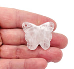 Clear quartz butterfly gemstone pendant with hole for necklace, featuring a polished, transparent crystal design from GemstoneGO.