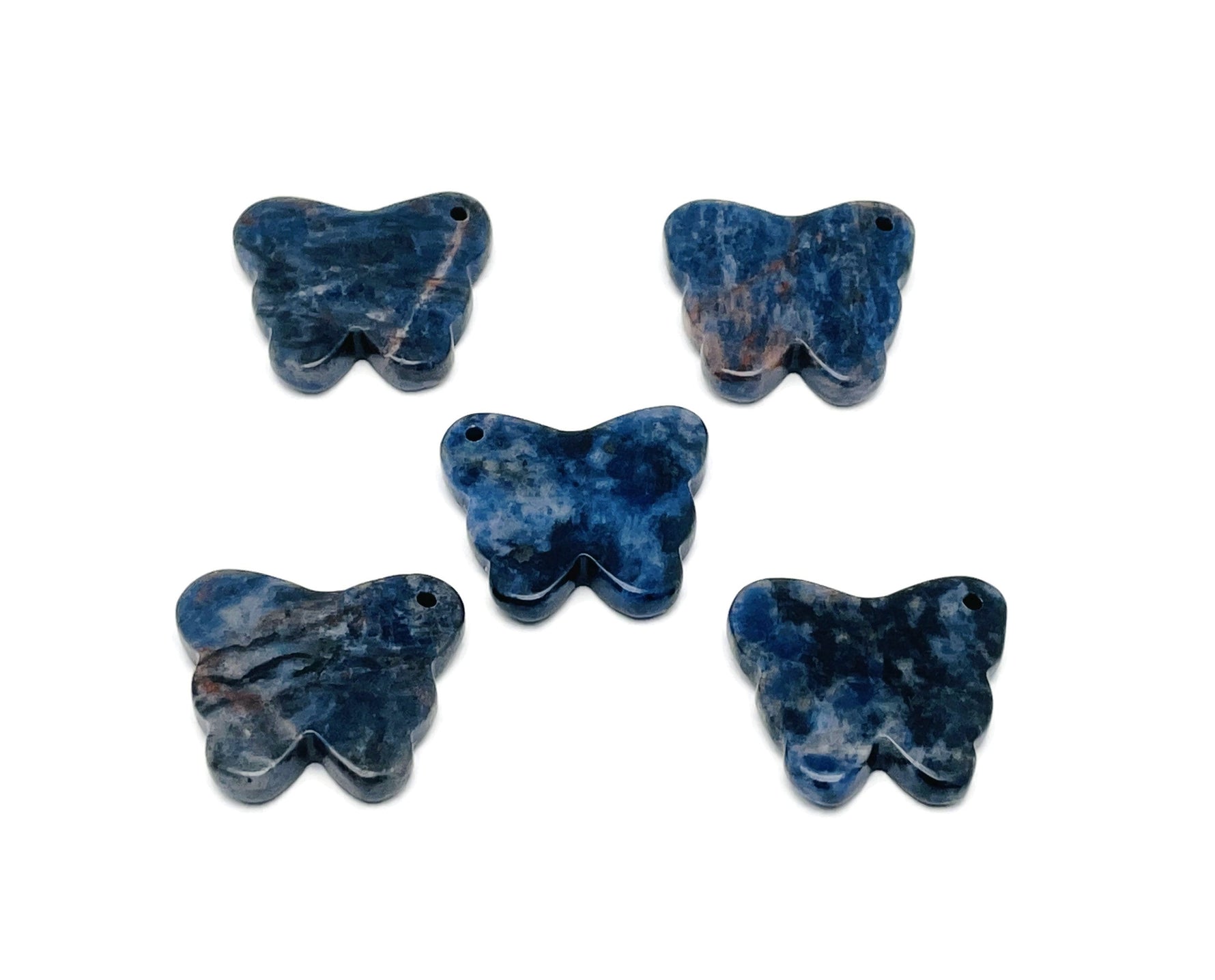 Sodalite butterfly gemstone pendant with hole for jewelry, showcasing vibrant blue and white crystal details on a silver chain