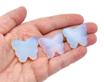Opalite butterfly gemstone pendant with hole crystal jewelry design, showcasing a delicate butterfly shape and iridescent opalite stone.