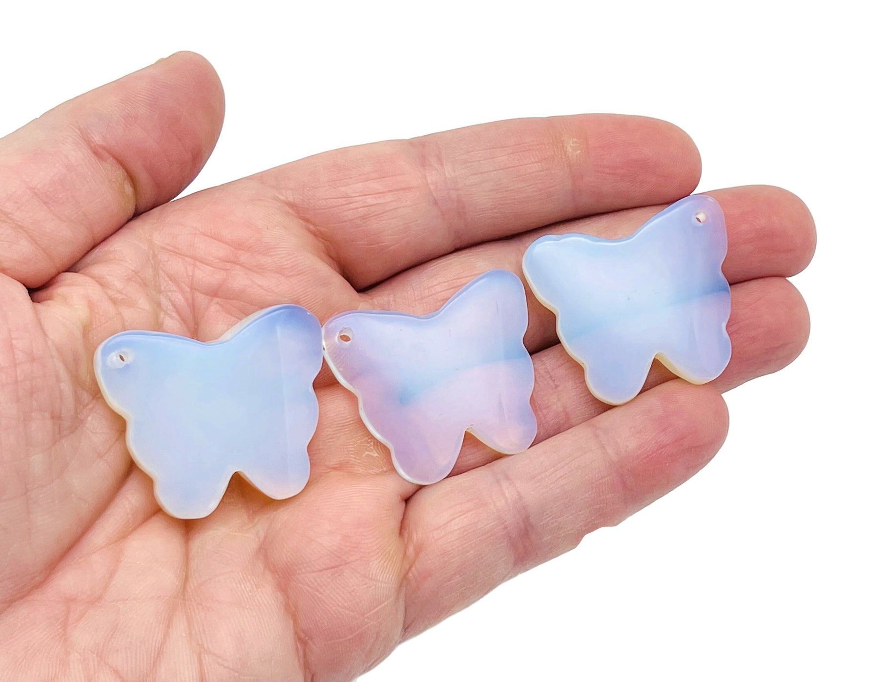 Opalite butterfly gemstone pendant with hole crystal jewelry design, showcasing a delicate butterfly shape and iridescent opalite stone.