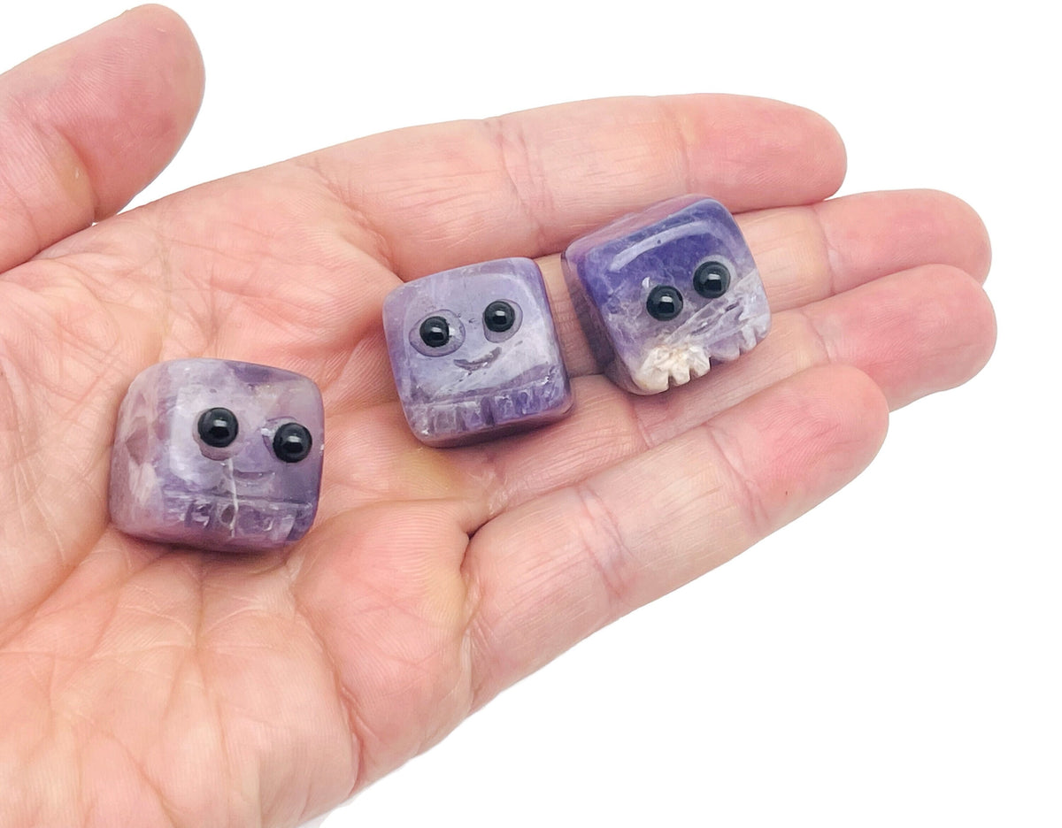 Amethyst handmade carving skull gemstone by GemstoneGO showing detailed purple crystal skull for jewelry or display.