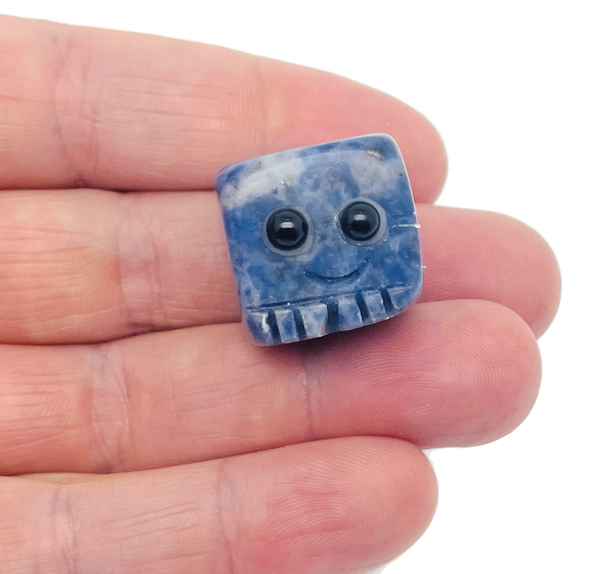 Handmade sodalite gemstone carving skull, detailed blue crystal sculpture, ideal as a unique gift or decorative gemstone sculpture.