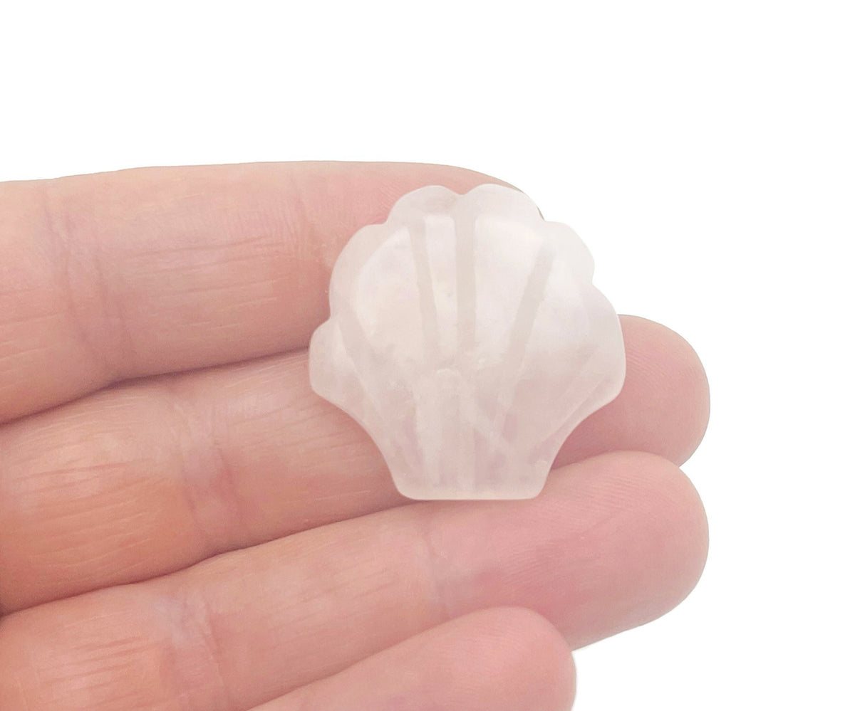 Rose quartz sea shell gemstone carving, 30mm, with intricate details showcasing delicate shell and gemstone craftsmanship.