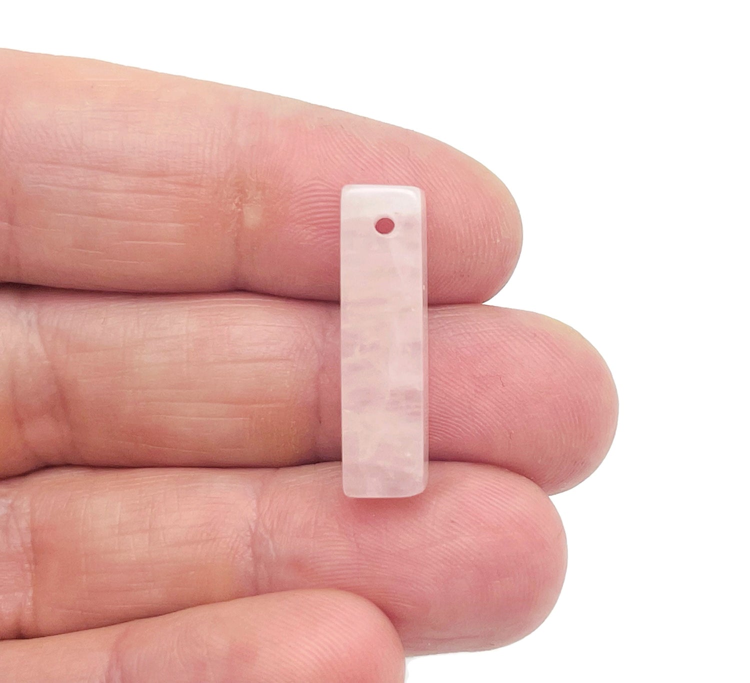 Rose quartz crystal pendant with drilled hole, ideal for jewelry making, from GemstoneGO, showcasing a smooth pink gemstone.