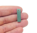 A polished aventurine crystal pendant with a drilled hole for jewelry making, displayed on a white background.