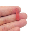 Cherry quartz crystal pendant from GemstoneGO, drilled gemstone for jewelry making, showcasing vibrant red color and smooth polished surface.