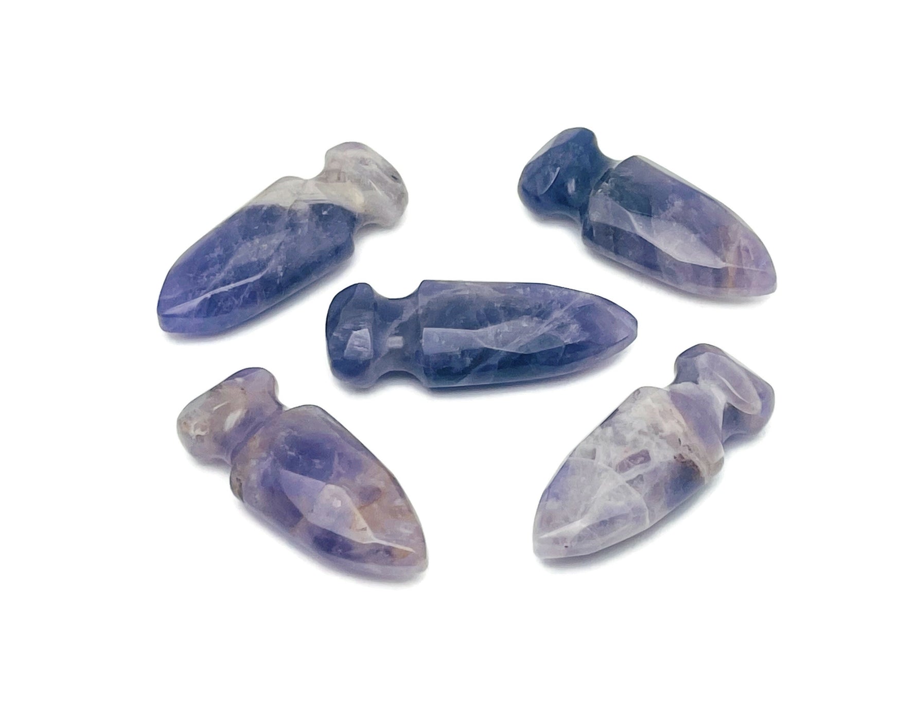 Carved amethyst sword dagger gemstone, 50mm, with intricate details and vibrant purple color, by GemstoneGO.