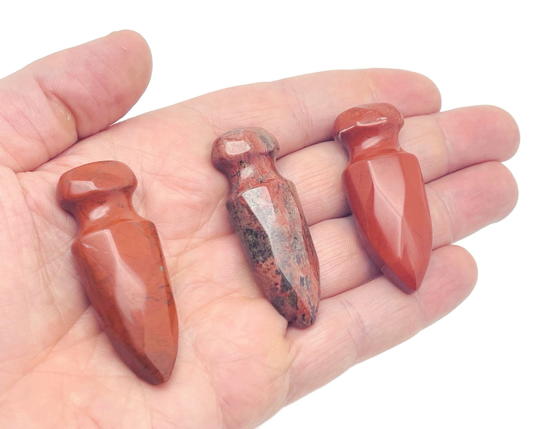 Carved gemstone dagger with crystal energy, mineral specimen from GemstoneGO, 50mm, featuring colorful mixed gemstones and intricate carving.