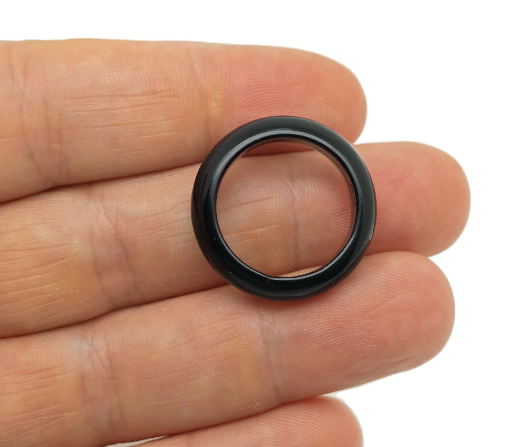 Obsidian crystal ring from GemstoneGO featuring a polished black gemstone set in a silver band, showcasing elegant jewelry design.