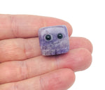 Handmade amethyst gemstone carving skull, detailed crystal sculpture by GemstoneGO, suitable as a unique gift for kids.