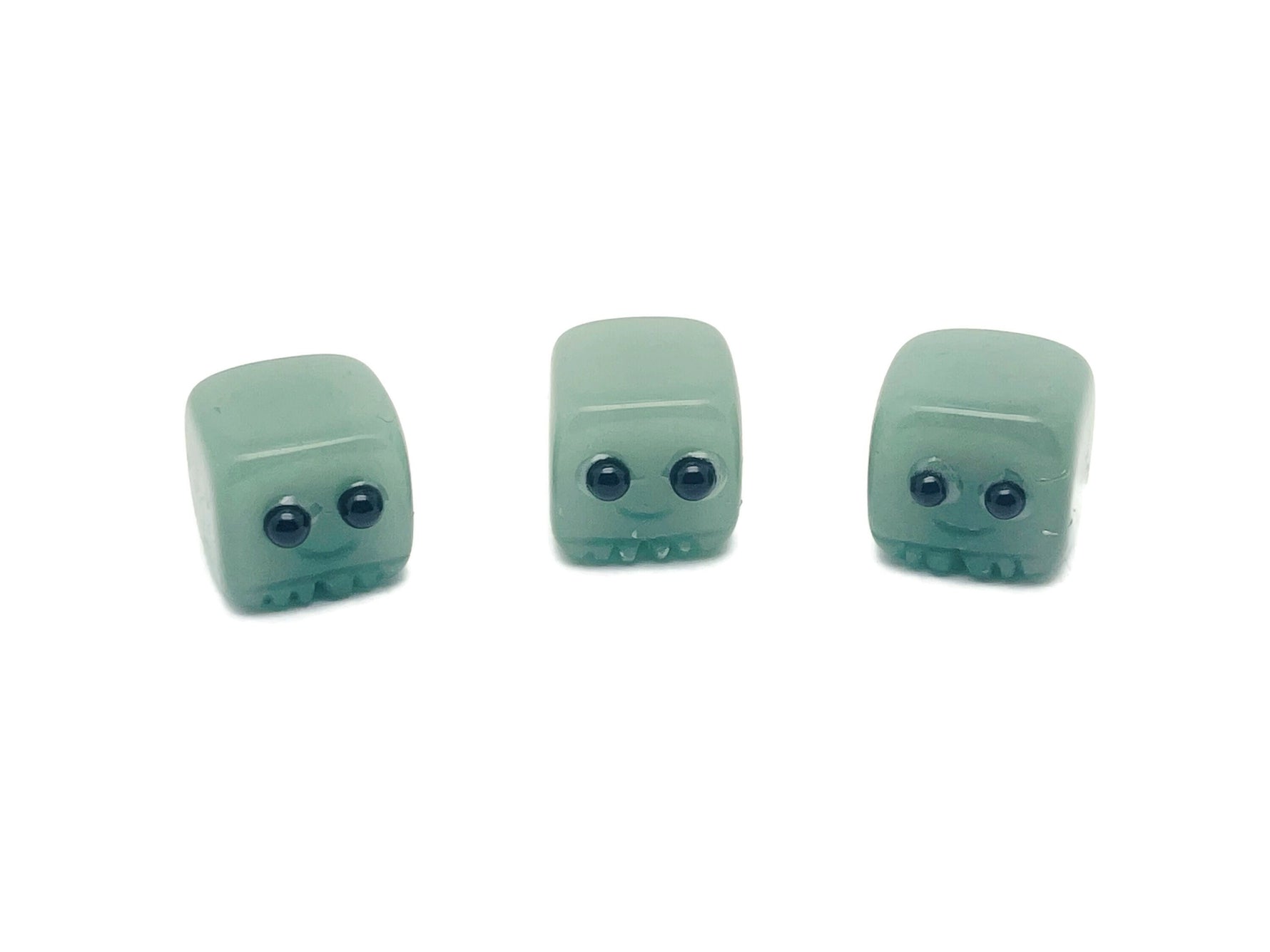 Handmade aventurine gemstone carving of a skull, detailed crystal sculpture, perfect as a gift for kids, by GemstoneGO.
