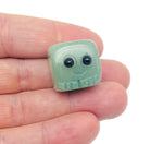 Handmade aventurine gemstone carving of a skull, detailed crystal sculpture suitable as a unique gift or decorative piece.