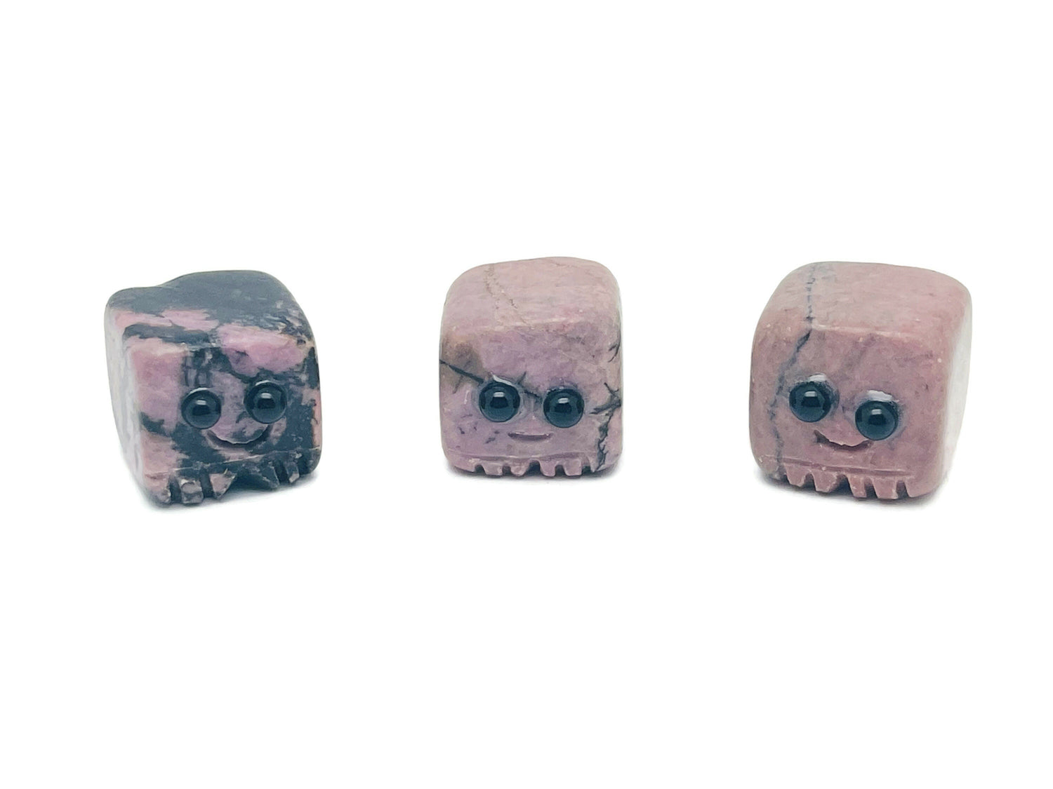 Handmade Rhodonite gemstone carving skull with detailed features, suitable as a crystal gift for kids, by GemstoneGO.