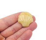 Yellow jade sea shell carving gemstone, 30mm, from GemstoneGO, showcasing intricate shell and jade details.