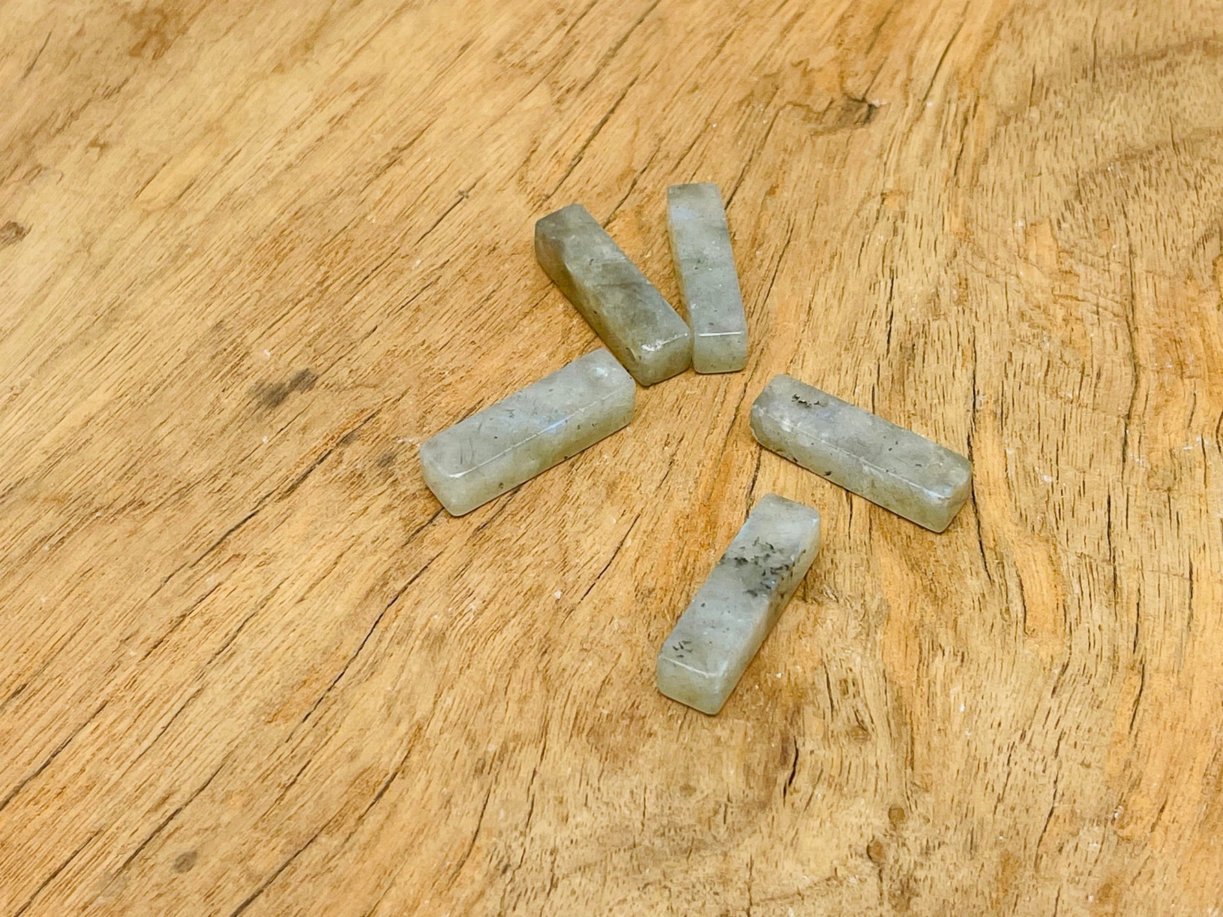 Labradorite crystal pendant by GemstoneGO, drilled gemstone for jewelry making, showcasing iridescent flashes and natural stone texture.