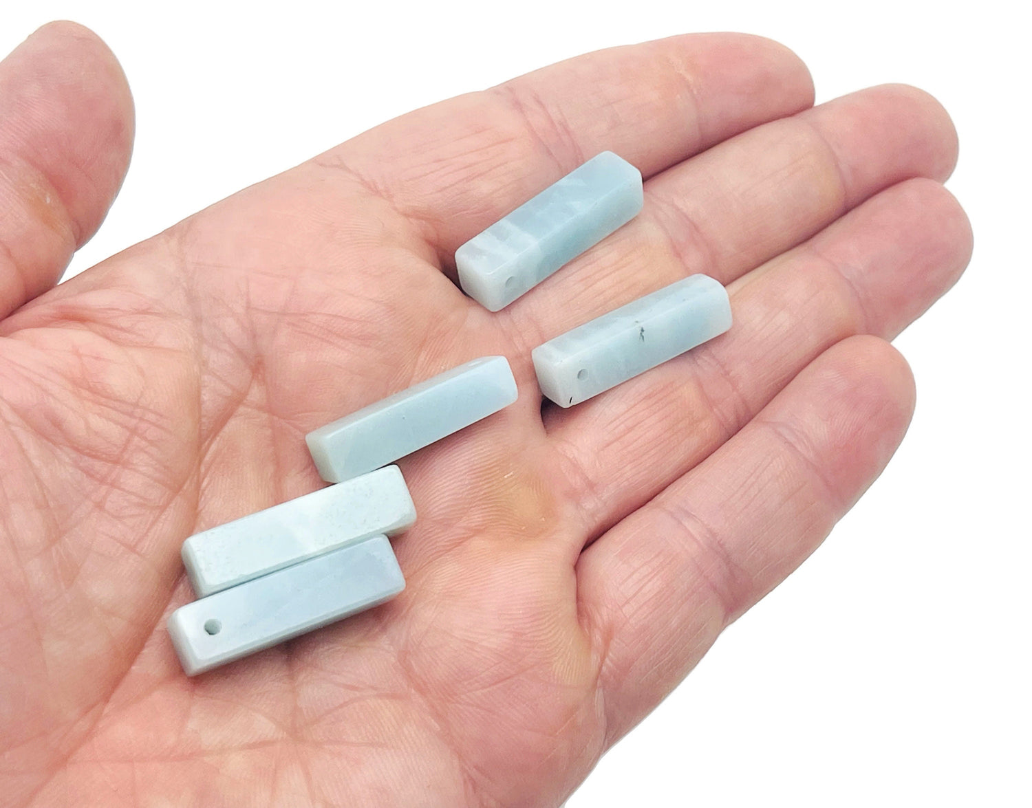 Amazonite crystal pendant from GemstoneGO, drilled gemstone for jewelry making, showcasing a vibrant blue-green polished stone.