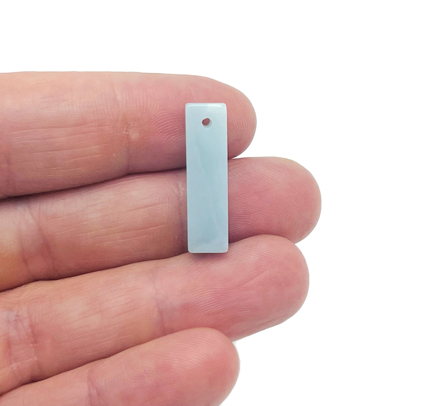 Amazonite crystal pendant from GemstoneGO, drilled gemstone jewelry pendant showcasing vibrant blue-green mineral with natural patterns.