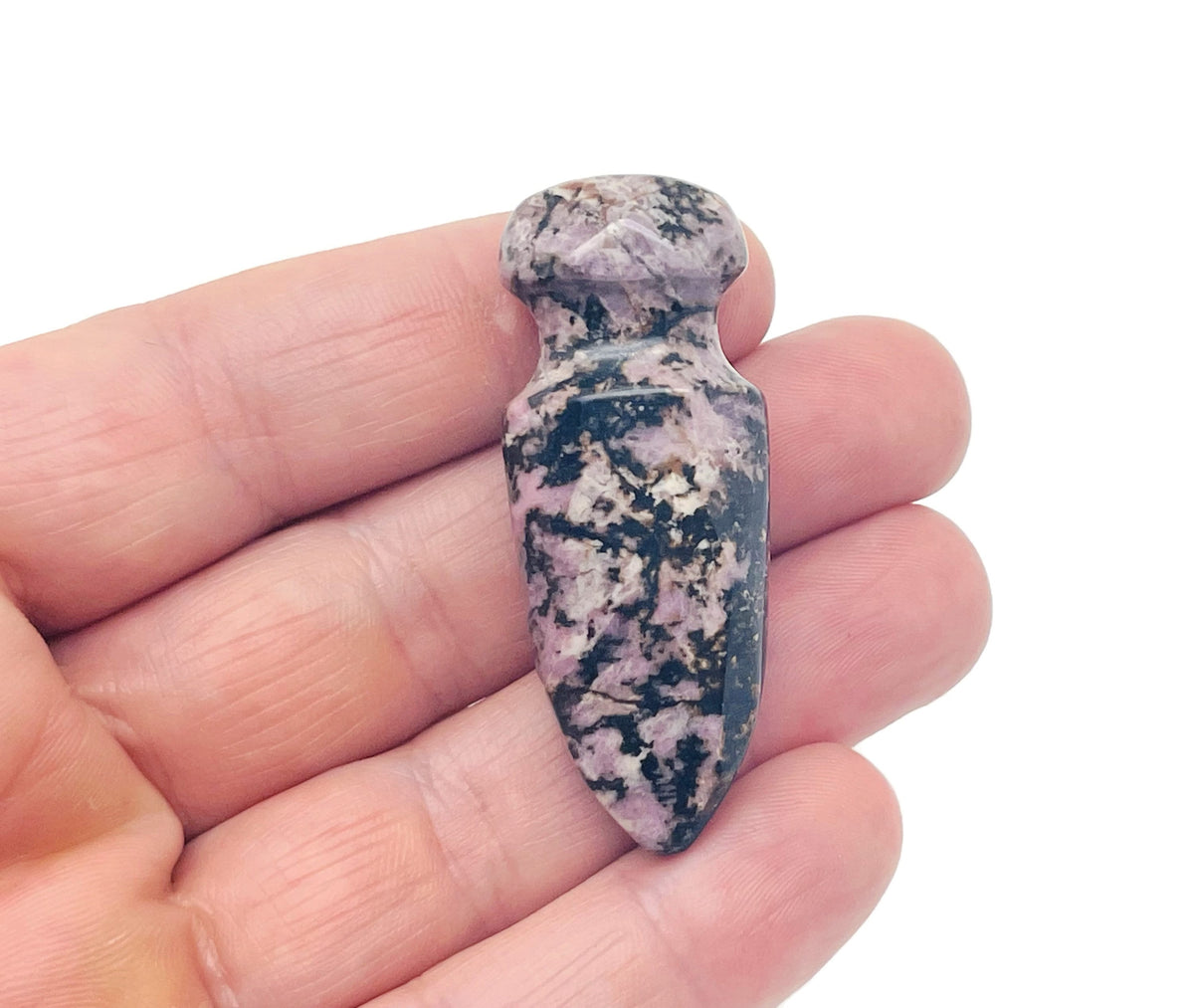 Carved Rhodonite gemstone sword dagger pendant, 50mm, featuring detailed carving and vibrant pink-red hues, by GemstoneGO.