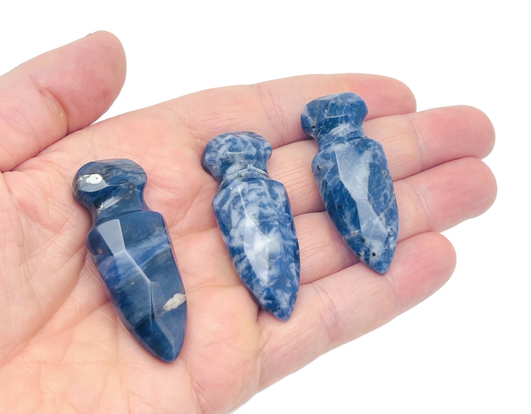 Carved Sodalite sword dagger gemstone, 50mm, with intricate details and rich blue color, from GemstoneGO.