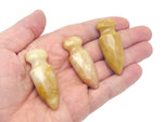 Yellow jade sword dagger carved gemstone, 50mm, with detailed craftsmanship, displayed on a neutral background.