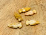 Yellow jade sword dagger carved gemstone, 50mm, with detailed carving and polished surface, suitable for jewelry or display.