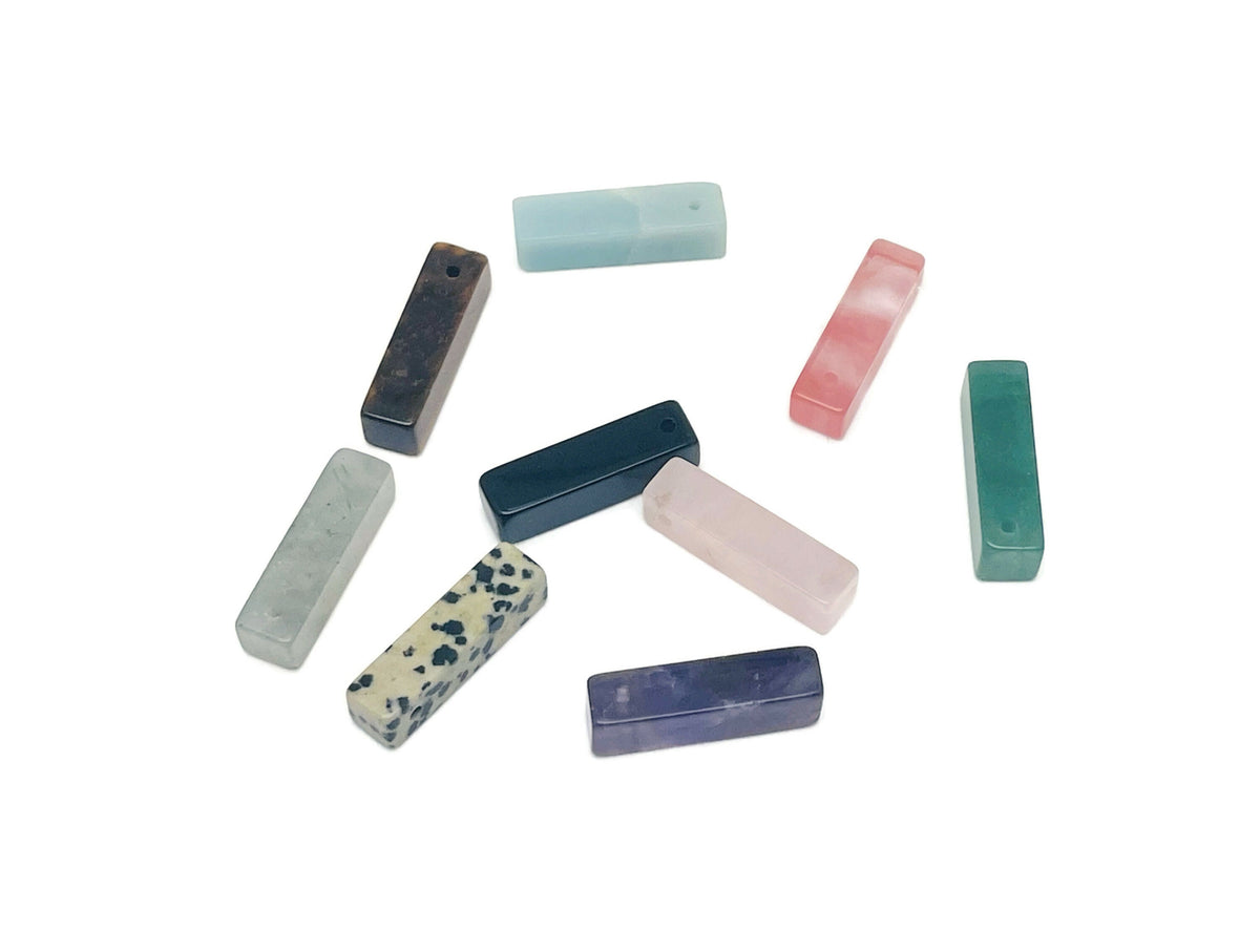 Drilled hole crystal pendant featuring a natural gemstone, ideal for jewelry making by GemstoneGO.