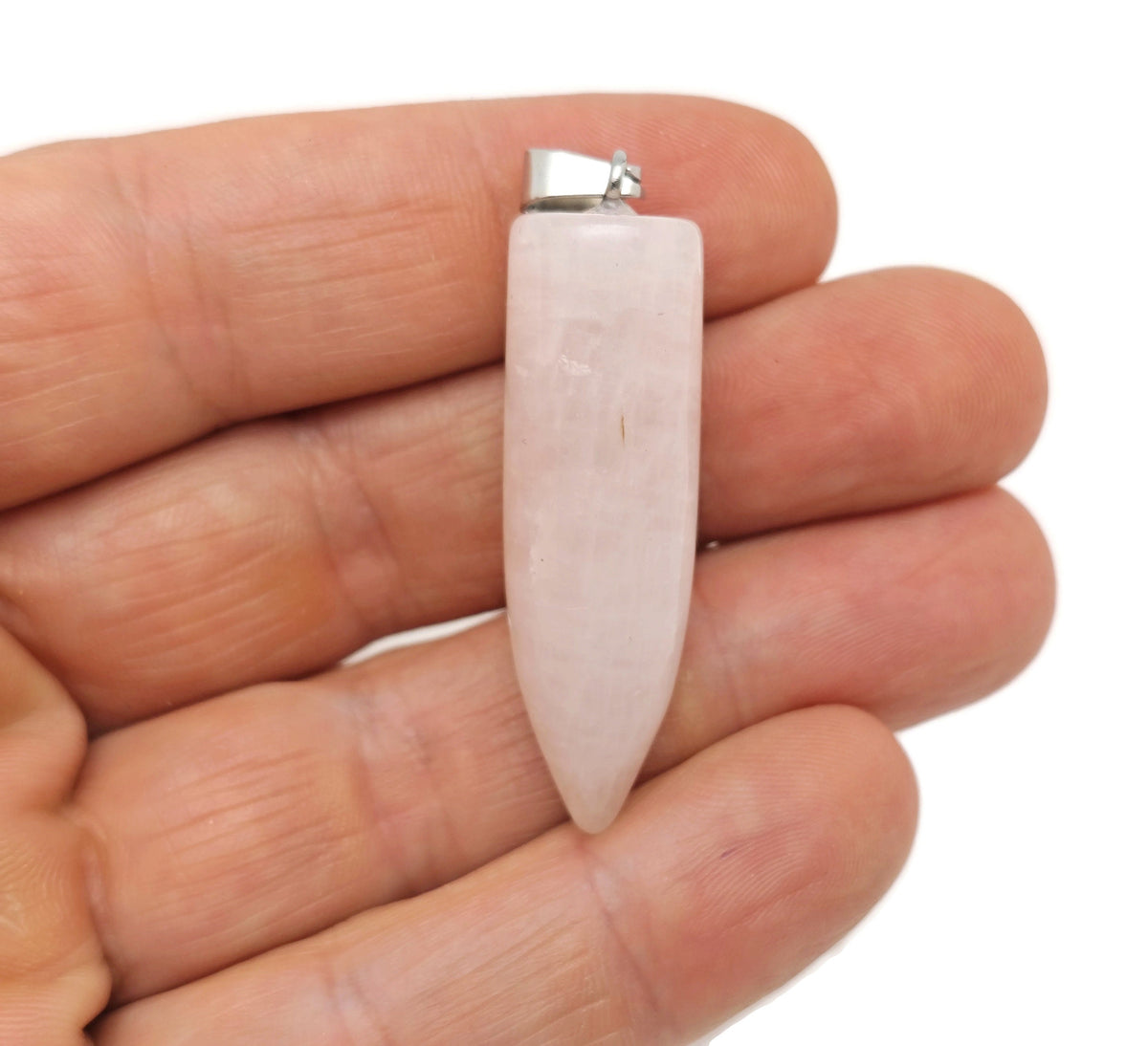 Polished rose quartz bullet gemstone pendant with carved details, hanging from a silver chain by GemstoneGO.