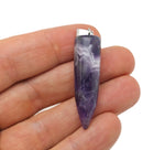 Polished amethyst bullet gemstone pendant with carved details, showcasing a smooth, purple quartz pendant from GemstoneGO.