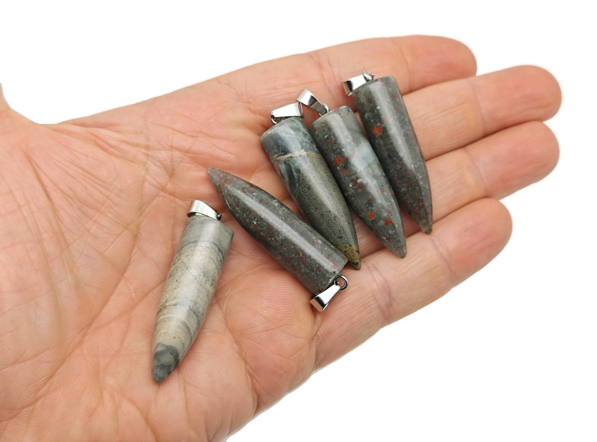 Polished African Bloodstone bullet gemstone pendant with carved details, featuring a glossy, smooth finish on a silver chain.