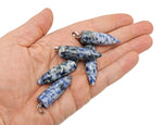 Blue Spot Jasper bullet gemstone pendant with polished carved bullet shape, featuring vibrant blue spots and smooth surface.