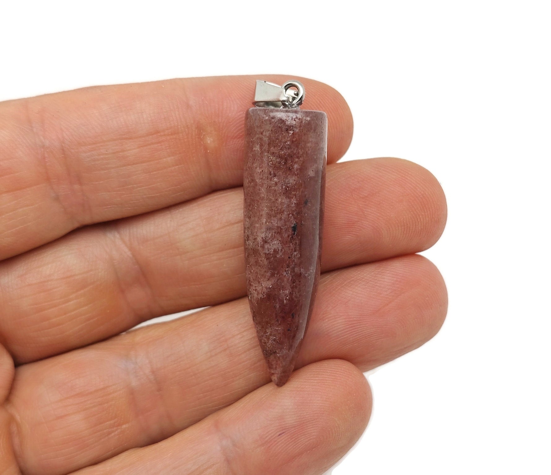 Polished strawberry quartz bullet gemstone pendant with carved details, showcasing a smooth, elongated shape and vibrant pink hue.