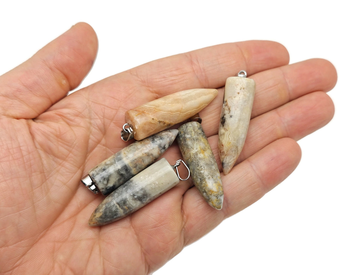 Polished gemstone bullet pendant with carved design, crystal healing mineral, from GemstoneGO, showcasing a smooth, rounded shape.