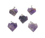 Amethyst wolf head gemstone pendant from GemstoneGO featuring a carved crystal wolf design on a silver chain.