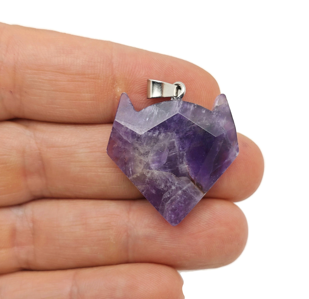 Amethyst wolf head gemstone pendant from GemstoneGO, featuring detailed crystal jewelry with purple amethyst stone.