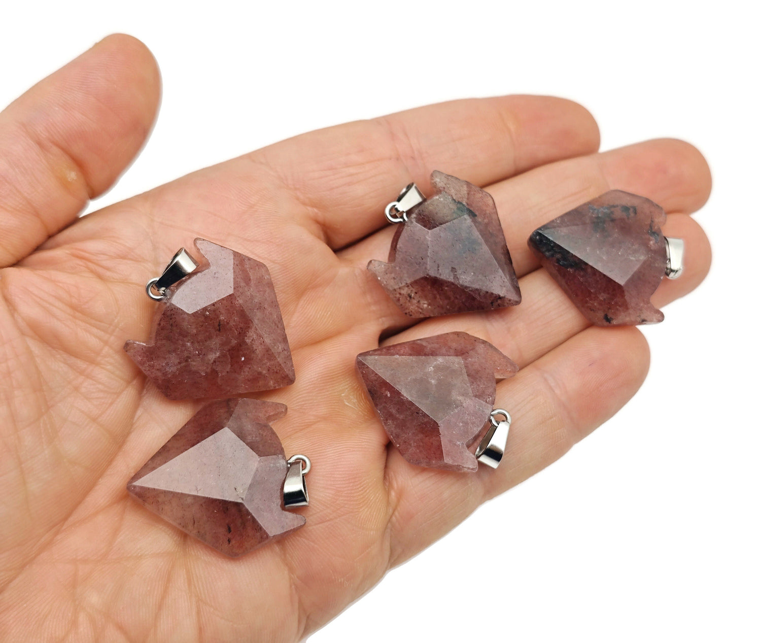 Strawberry Quartz wolf head gemstone pendant from GemstoneGO, featuring detailed crystal jewelry with vibrant pink stone.