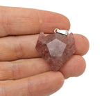 Strawberry Quartz wolf head gemstone pendant from GemstoneGO, showcasing detailed crystal jewelry with a vibrant pink hue.