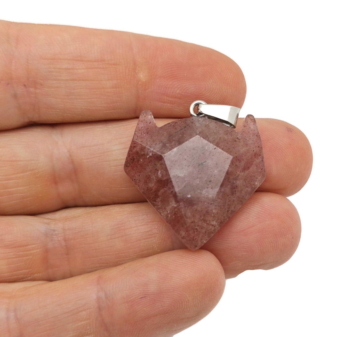 Strawberry Quartz wolf head gemstone pendant from GemstoneGO, showcasing detailed crystal jewelry with a vibrant pink hue.