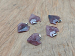Strawberry quartz wolf head gemstone pendant from GemstoneGO, showcasing detailed crystal jewelry with a wolf motif.