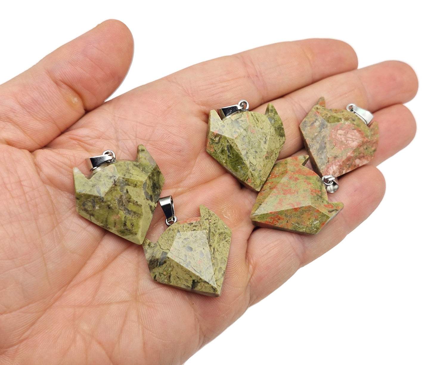 Unakite gemstone wolf head pendant from GemstoneGO, featuring detailed crystal jewelry craftsmanship with vibrant natural colors.