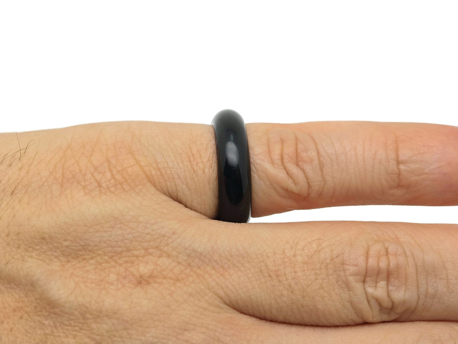 Obsidian crystal ring by GemstoneGO featuring a polished black volcanic stone set in a silver band.