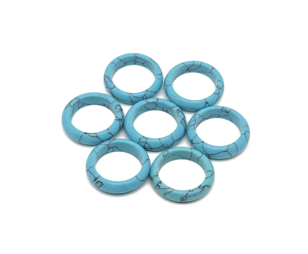 Turquoise crystal ring by GemstoneGO featuring a polished turquoise stone set in a silver band, showcasing elegant jewelry design.